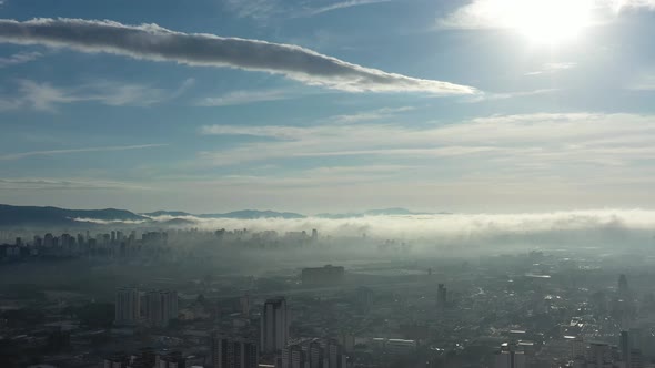 Above the clouds. Sunrise foggy morning.