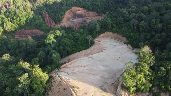 Drone view deforestation of land near the jungle