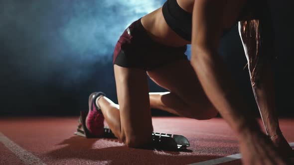 Professional Woman Athlete on a Dark Background To Run the Sprint of Jogging Shoes in Sneakers