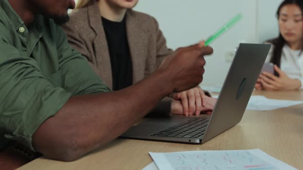 Business People Working and Communicating at Office Desk Together