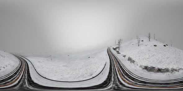 VR 360 Camera Moving Above Snow Rocky Mountains