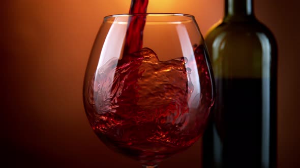 Super Slow Motion Shot of Pouring Red Wine From Bottle with Camera Rotation at 1000Fps alt