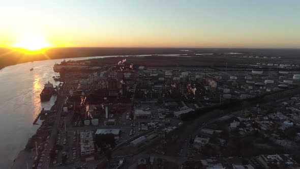 Aerial view power plant block. Water vapor rises to the sky. Power poles and chimneys in the backgro