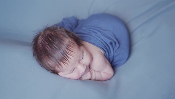 Close-up portrait of a young baby who has recently been born.