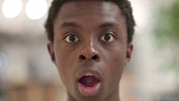 Close Up of Shocked Young African Man Face, Wondering