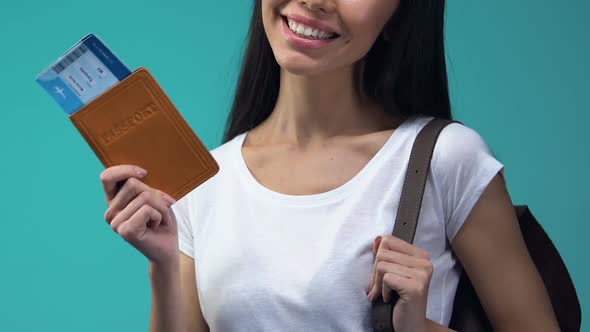 Happy Lady Holding Passport and Flight Tickets, Traveling Abroad, Vacation