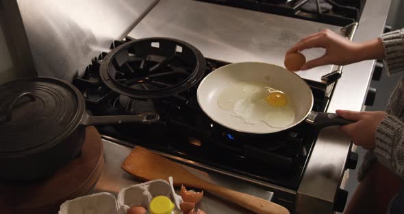 Caucasian woman cooking in her house