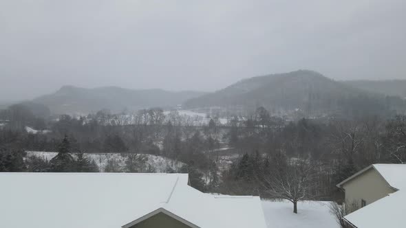 Snow over rural landscape in Wisconsin. Creeks, farmland, unique ground cover. Homes with view.