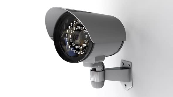 Security CCTV Camera on White Background Rotates and Monitoring for Crowd