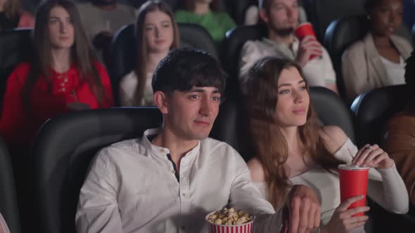 Young Couple Enjoying Movie Cinema