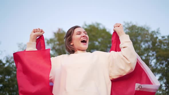 The Happy Canadian Celebrates and Rejoices in Success and Victory. A Resident of Canada. Woman with