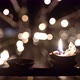 Burning Oil Candles Inside Dark Interior of Buddhist Temple - VideoHive Item for Sale
