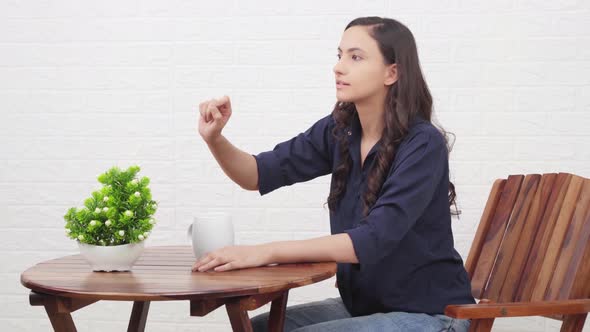 Indian girl calling a waiter