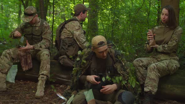 Special Forces Squad Coming to Halt Preparing MRE Resting in Forest