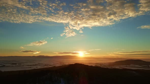 Sunset Over Mountains Covered with Forest