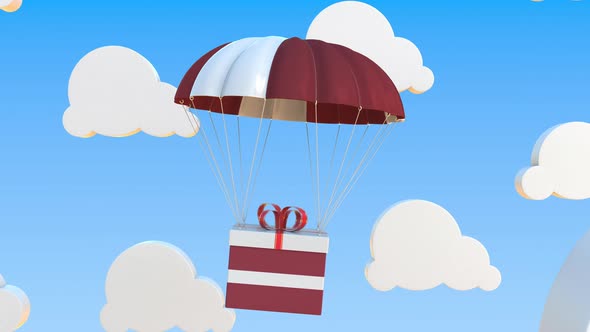 Carton with Flag of Latvia Falls with a Parachute