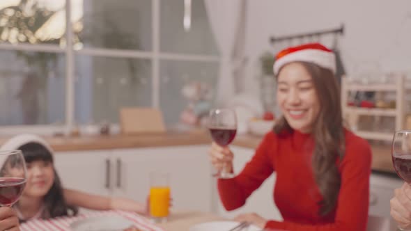 Asian lovely family member feel happy and excited to celebrate christmas party together in house.