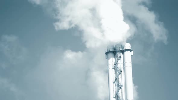 Large Pipe of Smoke Pipe Thermal Power Plant in Light on a Sunny Day