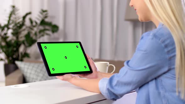 Woman Has Video Call on Tablet with Green Screen 143