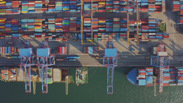 Loading and Unloading a Container Ship in the Port at the Pier