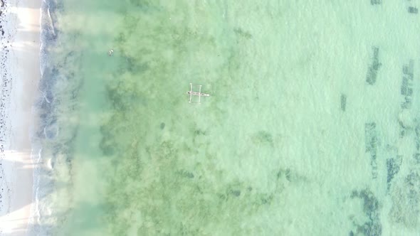 Vertical Video of the Ocean Near the Coast of Zanzibar Tanzania Aerial View