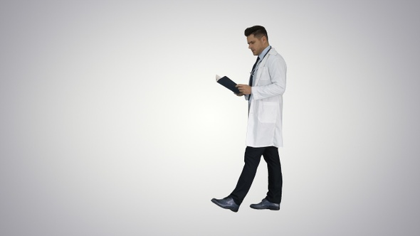 Concentrated medical doctor reading documentation while