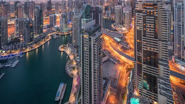 Dubai Marina Skyscrapers and Jumeirah Lake Towers View From the Top Aerial Night to Day Timelapse in