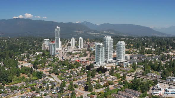 Aerial View Of Area Around Burquitlam Station In Coquitlam, British Columbia, Canada With Mountainou