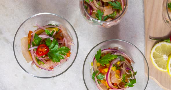 Traditional Ceviche bowls. Top view on a kitchen table