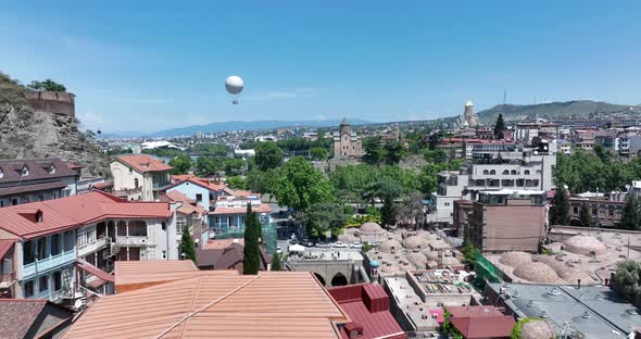 Aerial view of Metekhi church in old Tbilisi located on cliff near river Kura