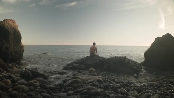 Man watching the horizon at a Rocky Beach in Spain, Gran Canaria