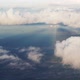 Plane soaring through cloud, aerial view of city and ocean nature landscape winter slow motion video - VideoHive Item for Sale