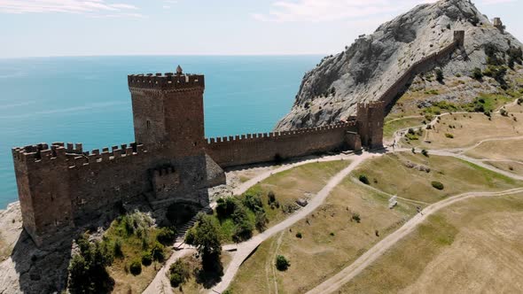 Aerial Around Stone Towers Wall Genoese Fortress Citadel on Mountain in Bay of Black Sea Sudak