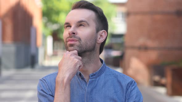 Portrait of Thinking Casual Man in Office