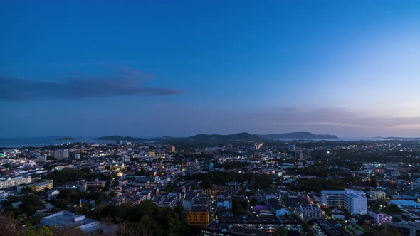 Phuket city aerial scenic view, during sunset twilight; day to night  - Time Lapse