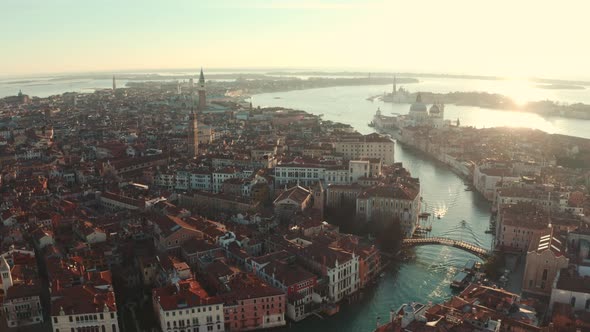 Beautiful drone shot over Grand  canal towards Basilica di Santa Maria Venice Italy at sunrise