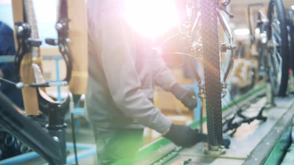 Bicycle Is Getting Manufactured By a Factory Technician