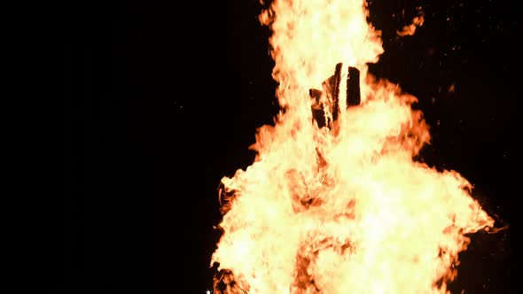 Big Bonfire Burns at Night in Slow Motion on a Black Background on Nature