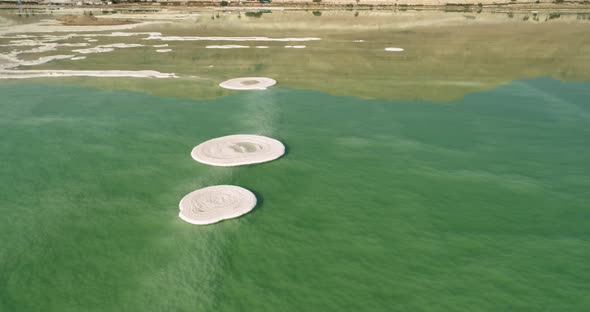 Aerial view of circle salt formation in the water. Dead sea, Negev, Israel.