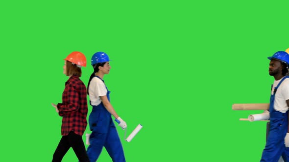 Many People of Different Construction Professions Walking By on a Green Screen Chroma Key