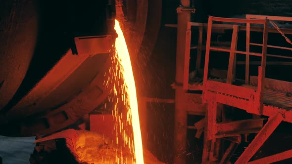 Flow of Melted Metal Pouring From the Factory Tank