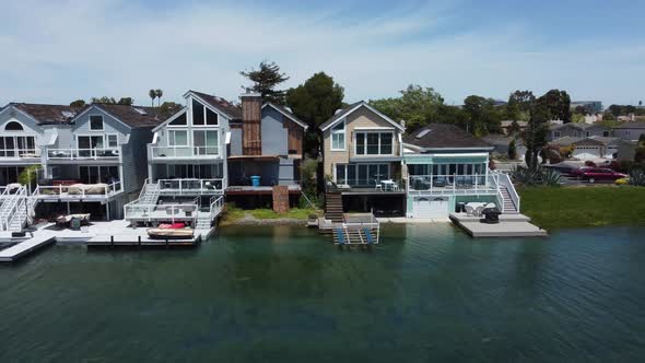 Slider Close Shot Of Riverside Villas And Residential Properties Alongside At San Mateo Aquatic Park