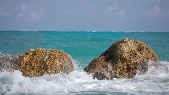 4K Slow Motion Waves Crashing Over Rocks- Tropical Water