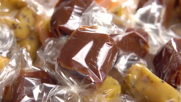 Different toffee candy close up. Wrapped taffy candies. Christmas treats. Taffy-toffy