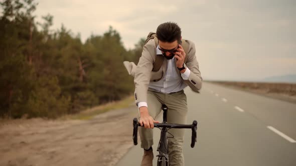 Businessman In Suit Riding On Bicycle. Trip To Work On Bike. Cyclist Businessman Hurry To Work.