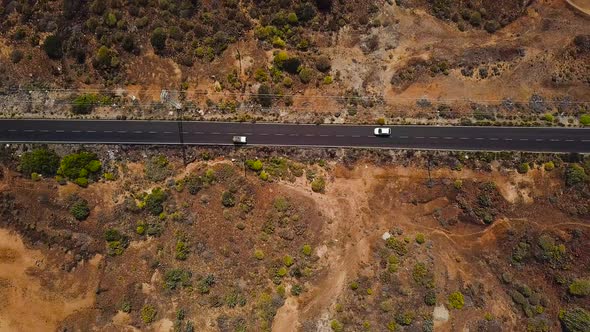 Top View of a Car Rides Along a Desert Road on Tenerife Canary Islands Spain