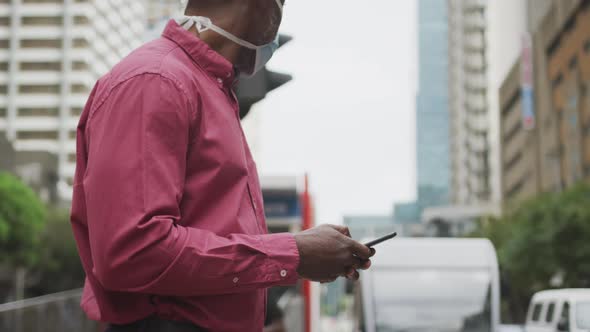 African american man on the go wearing coronavirus covid19 mask