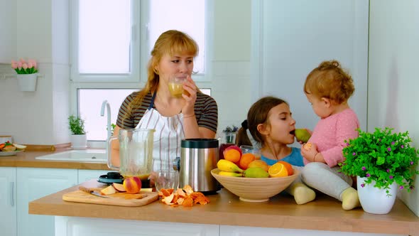 The Family Prepares Smoothies at Home