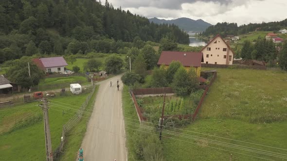 Aerial panoramic view of Colibita, with views of the lake and nature, during Tura Cu Copaci cycling