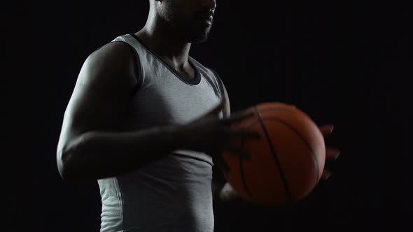 Latin Basket Player Checking and Catching the Ball on Black, Self-Development